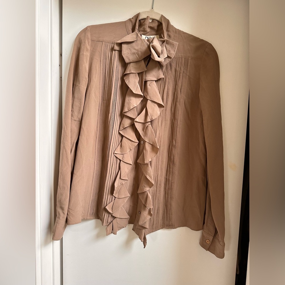 Chloe button up bow top. Equivalent to a size M.